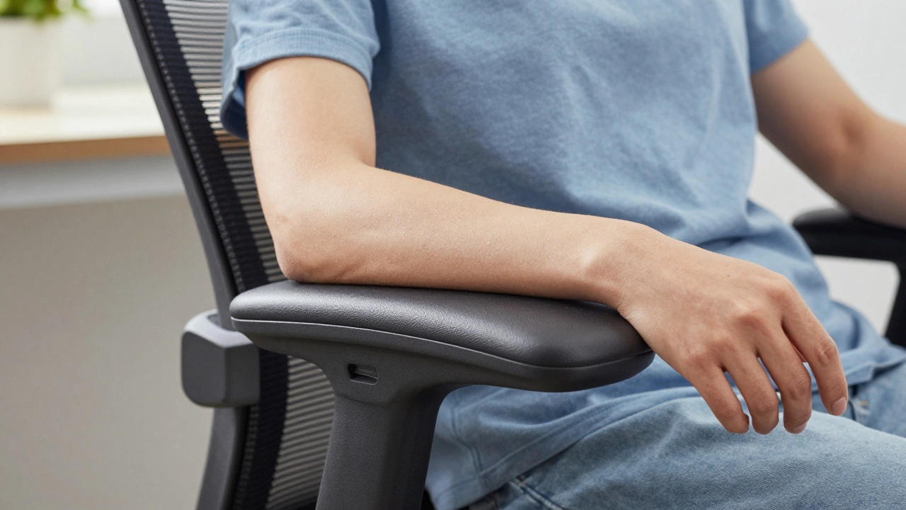 Relaxed forearms resting correctly on adjustable office chair armrests